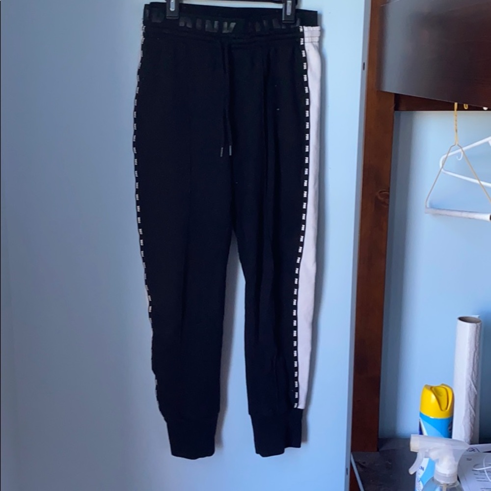 pink brand black sweatpants with white side stripe